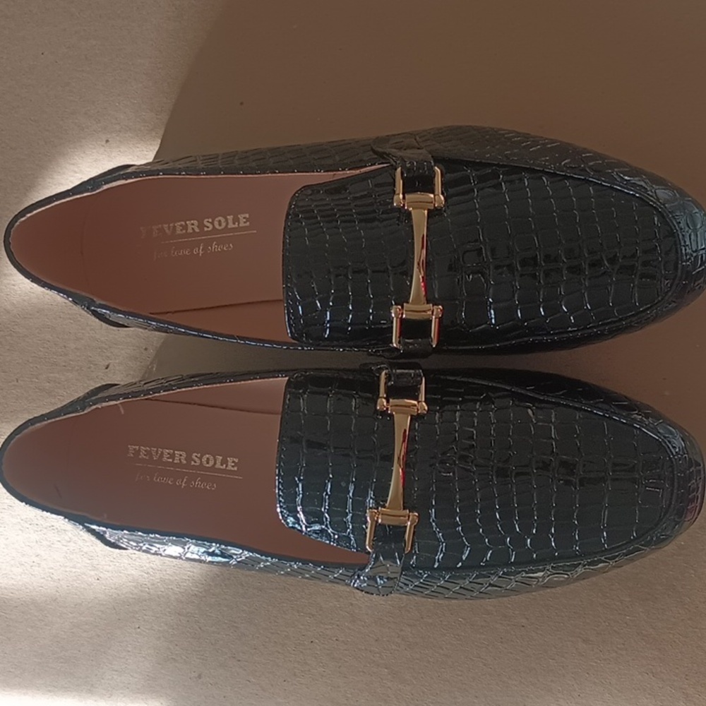 Black embossed loafers